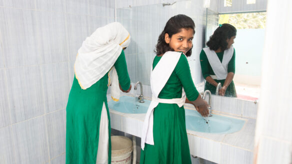 Girl in Bangladesh washing her hands
